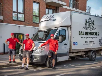 Employees of the office relocation company Sal Removals standing in front of their company van